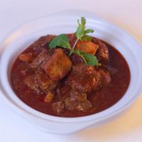 Burmese Style Beef Curry · Diced beef simmered in lemongrass, onions, ginger, garlic, masala, potatoes, paprika, curry ...