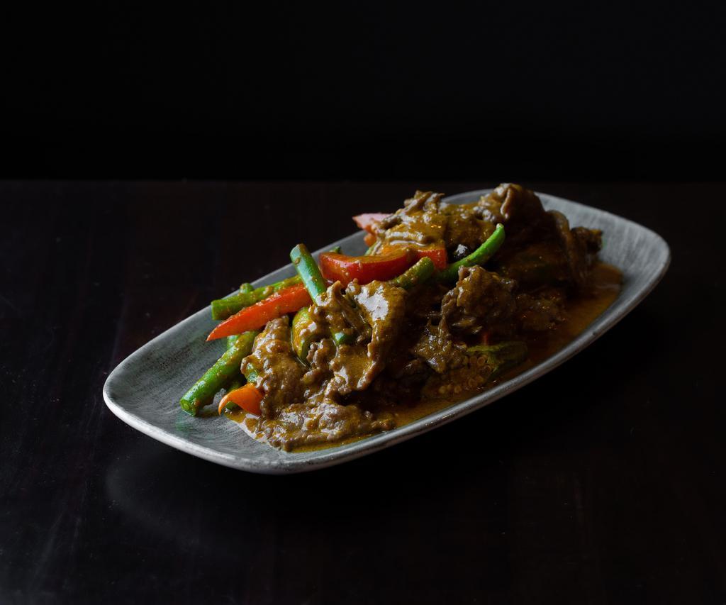 Dry Curry Beef · Beef, coconut milk, evaporated milk, string bean, okra, lemongrass, garlic, turmeric, paprika, curry powder, and blue ginger. 
Gluten-free.