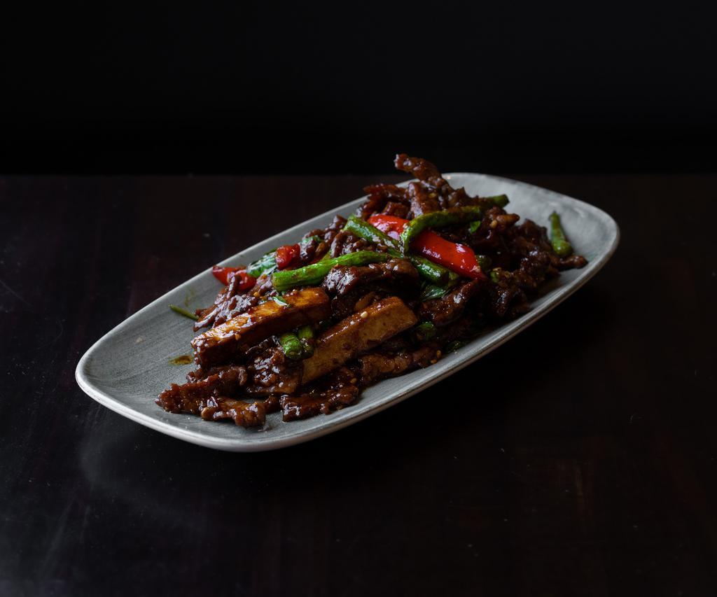 Beef Tofu · Tri tip wok-fried with tofu, string beans, bell peppers, garlic, ginger, vinegar, sambal chili, basil in a hoisin and oyster sauce.
Gluten-free option available.