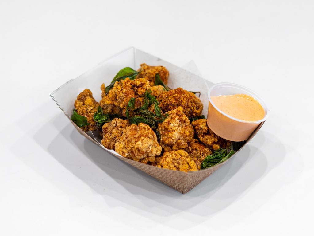 Basil Popcorn Chicken · Includes gluten. Lightly coated popcorn chicken. Extra sauce for an additional charge.