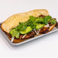 Banh mi torta  ·  banh mi sandwich with grilled baguette
Includes pickled daikon & carrot, jalapeños, cilantr...