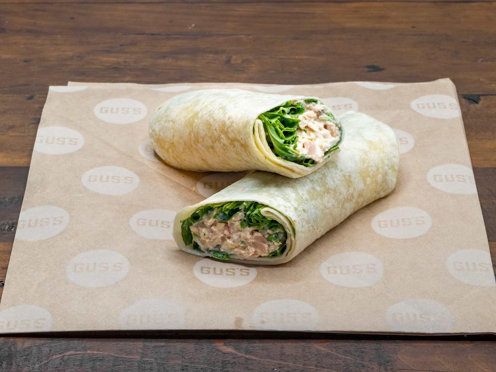 Tuna Wrap · Tuna salad made with tuna, mayo, celery, red onions, whole grain mustard, salt, and pepper. In a flour tortilla with Asiago cheese and wild arugula.