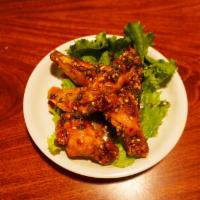 Spicy Basil Chicken Wings / 6 wings · Deep fried chicken wings tossed in a basil infused sweet, spicy and sour sauce.