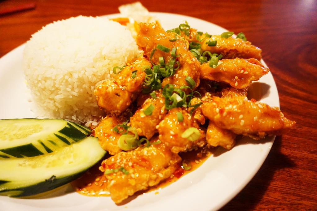 Sesame Chicken · Our version of sesame chicken is made with thick chunks of chicken, lightly battered and deep-fried.  Then sautéed in a sweet and tangy sesame sauce.