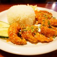 Sesame Shrimp · Our version of sesame shrimp is made with large butterflied shrimp, lightly battered and dee...