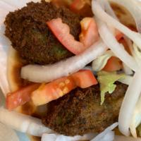 Falafel Sandwich · Sandwich is loaded with 3 pieces of our homemade falafel inside a fluffy pita bread with let...
