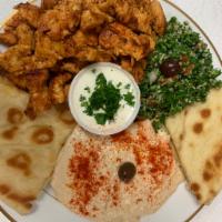 Greek Dinner · Our Greek dinner comes with our homemade tabouli, hummus, fluffy pita bread and your choice ...