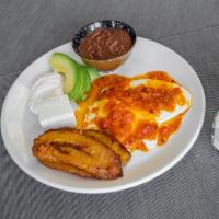 Ranchero Breakfast · Sunny eggs, sauce, farm cheese, sour cream, avocado, plantain, and beans.