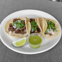 Order 3 Beef Mexican Tacos · With Onions and coriander on the top
