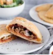 Calzone · Filled with mozzarella and ricotta cheese and served with marinara dipping sauce. Add toppin...