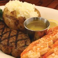 Steak & Broiled Shrimp · Hand-cut, 6oz. steak paired with two skewers of broiled shrimp. Served with fresh cut lemon,...
