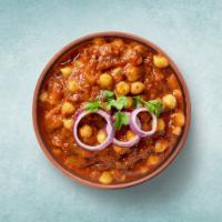 Tangy Garbanzo Curry · Chickpeas cooked in an onion and tomato curry with Indian whole spice. 