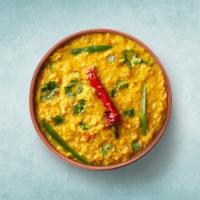 Tempered Yellow Lentils  · Yellow lentils cooked with Indian spices, herbs and topped with coriander sprinkle on it. 