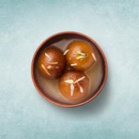 Gulab Jamun  · Soft cottage cheese dumplings steeped in sweet sugar and saffron syrup.