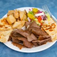 Gyro Platter · Slices of gyro with lemon potatoes, Greek salad and toasted pita bread.