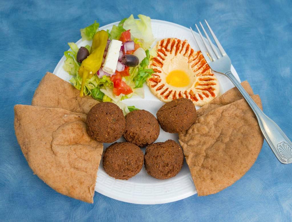 Falafel Platter · 3 pieces of falafel, hummus, with lemon potatoes, Greek salad and pita bread.