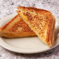 Kids Grilled Cheese · A traditional grilled cheese sandwich on Texas toast with a kid's portion of French fries an...