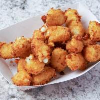 Cheese Bites · Lightly breaded Wisconsin Cheese Curds served with marinara dipping sauce.