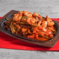 Pepe's Fajita Combo · Broiled and marinated steak, chicken and shrimp, with sauteed Spanish onions, tomatoes and b...