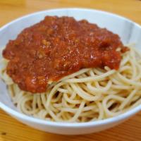 Spaghetti with Meat Sauce · A hearty portion of spaghetti with homemade meat sauce (100% Beef). Served with 2 pieces of ...