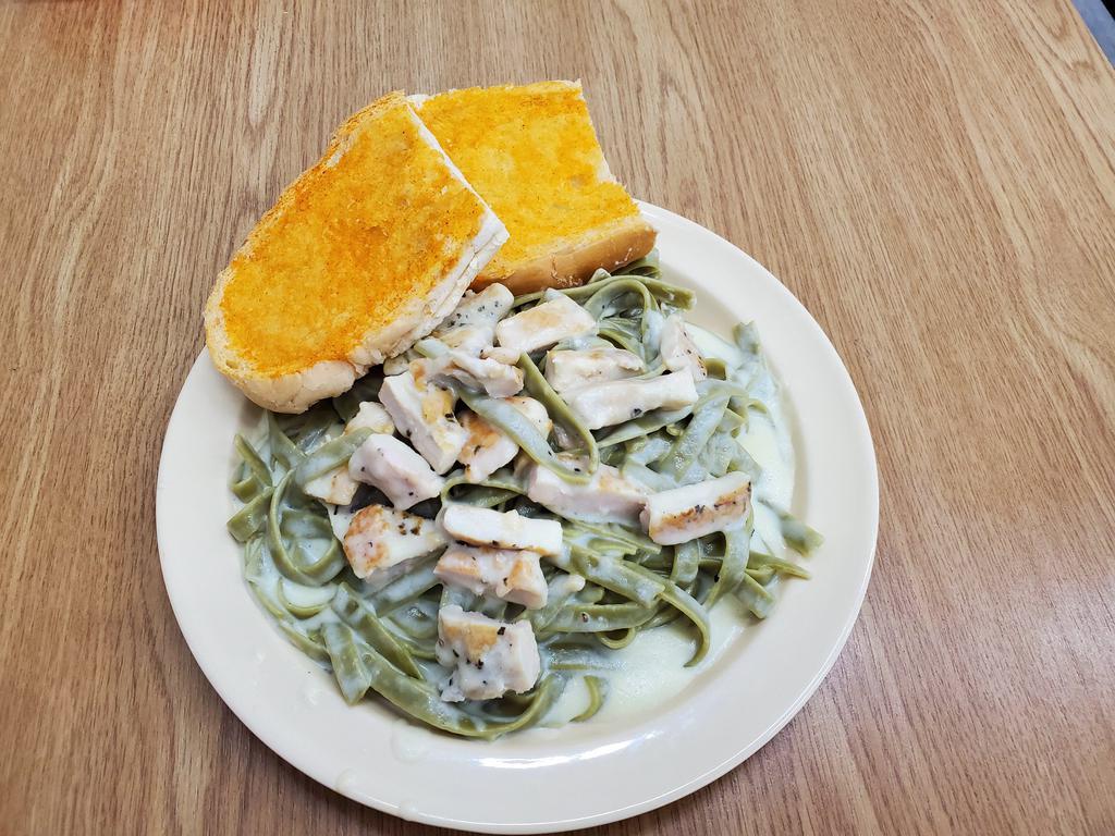 Chicken Fettuccine Alfredo · A hearty portion of fettuccine with homemade Alfredo sauce, with seasoned grilled chicken.
Served with 2 pieces of toasted garlic bread.