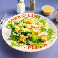 Caesar Salad · Crisp romaine lettuce tossed with creamy caesar dressing of Parmesan cheese and croutons.