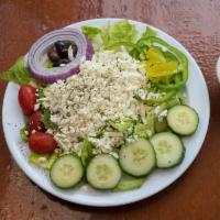 Greek Salad · Romaine lettuce, tomato, red onion, bell peppers, Kalamata olives and feta cheese served wit...
