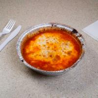 Lasagna · Layers of pasta, ground beef, mozzarella, Parmesan and ricotta cheeses oven baked with marin...