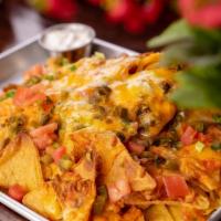 Street Tray Nachos · Classic nachos topped with tomatoes, jalapenos, Jack & cheddar.
Salsa & sour cream.
