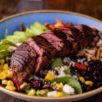 Steak & Avocado Salad · Marinated flank steak, baby salad greens, roasted red peppers, queso fresco, black bean & co...