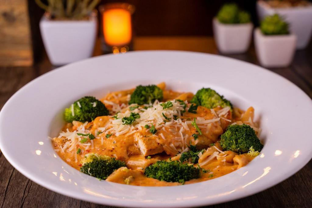 Chicken Milanese · Grilled marinated chicken breast, broccoli florets, sun dried tomato cream sauce. Penne pasta. Toasted French baguette.