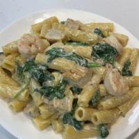 Shrimp Rigatoni Alfredo  · Rigatoni w/Shrimp and Spinach tossed in a creamy Alfredo sauce topped with Parmesan cheese.