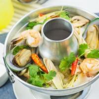 30. Seafood Soup · Spicy soup with mixed Seafood ( Scallop, Green Muscle, Fish ,Shrimp and Squid )  and mushroo...