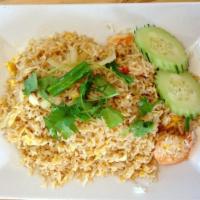 71. Thai Fried Rice · Fried rice with egg, onions and tomatoes.