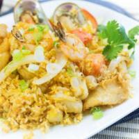 76. Seafood Fried Rice · Fried rice with egg, onions, tomatoes and combination of Seafood ( Scallop, Green Muscle, Fi...