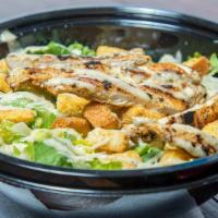 Classic Caesar · Fresh, crisp romaine with shredded parmesan cheese and croutons.