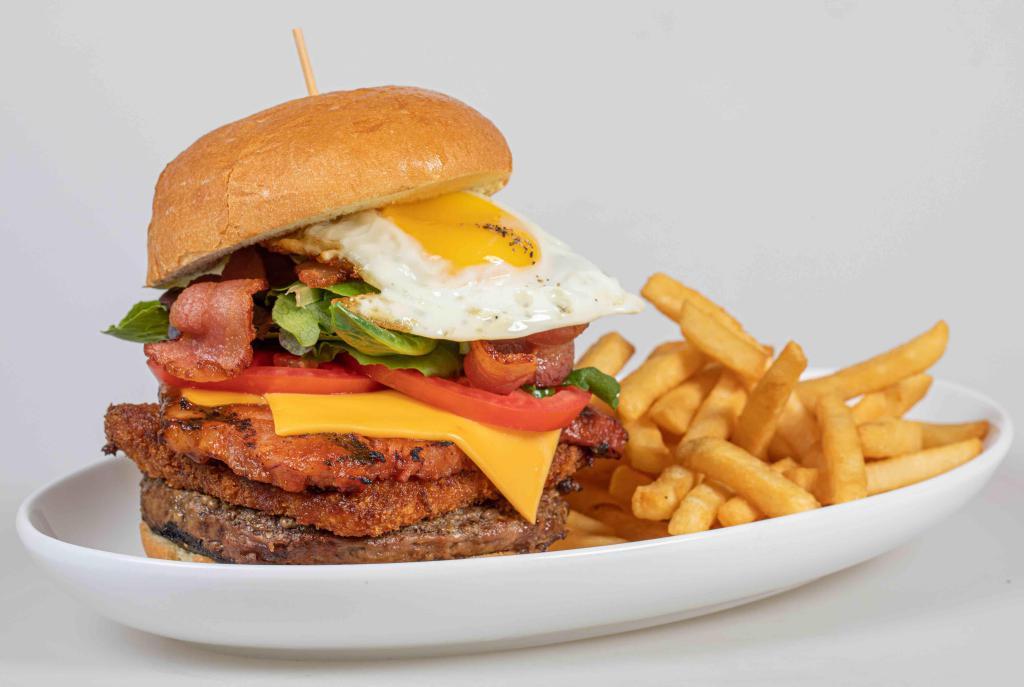 Bocas Burger  · 8oz beef, 6 oz pork smoked chop, Fried White Cheese, Special Sauce, bacon, lettuce, tomato, fried egg, Served with French fries.