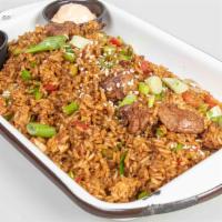 Special Fried Rice Wok- Smoked Lomo  · Fried rice with beef, vegetables and eggs.