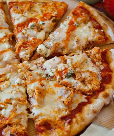 Buffalo Chicken Pizza · With buffalo chicken in a Buffalo sauce, onions, green bell peppers, and cilantro.
