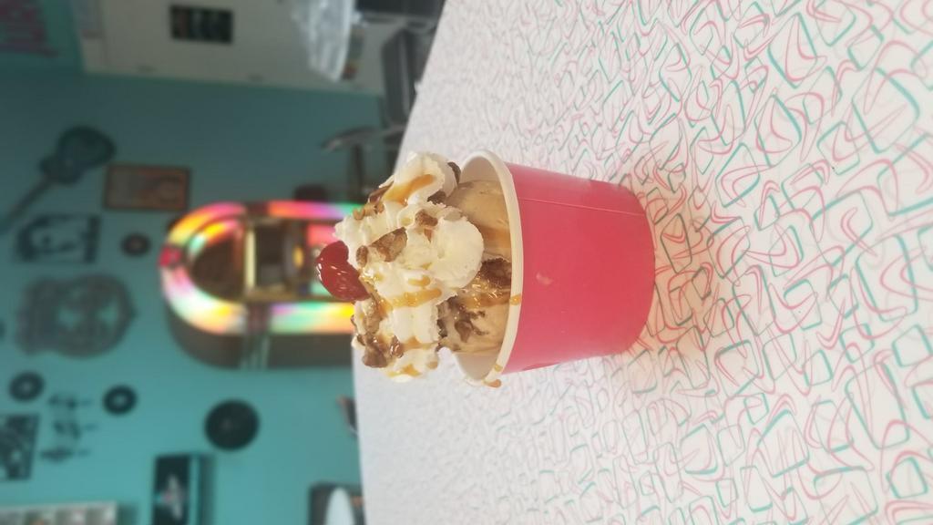 Turtle Sundae · Salted caramel ice cream topped with pecans, salted caramel, whipped cream and cherry.