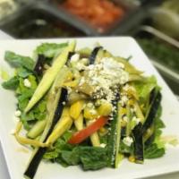 Large Grilled Vegetable Salad · Fresh romaine lettuce, grilled red and yellow peppers, yellow and green zucchini, eggplant a...