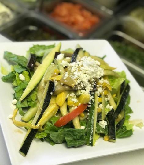 Large Grilled Vegetable Salad · Fresh romaine lettuce, grilled red and yellow peppers, yellow and green zucchini, eggplant and corn tossed in balsamic vinaigrette topped with feta cheese.
