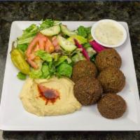 11. Falafel Platter · Falafel patties served with tahini sauce, homemade hummus, house salad and pickled turnips.