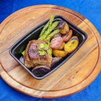 Garlic and Black Peppercorn Crusted Steak · Served with rosemary roasted potatoes and lemon and garlic asparagus.