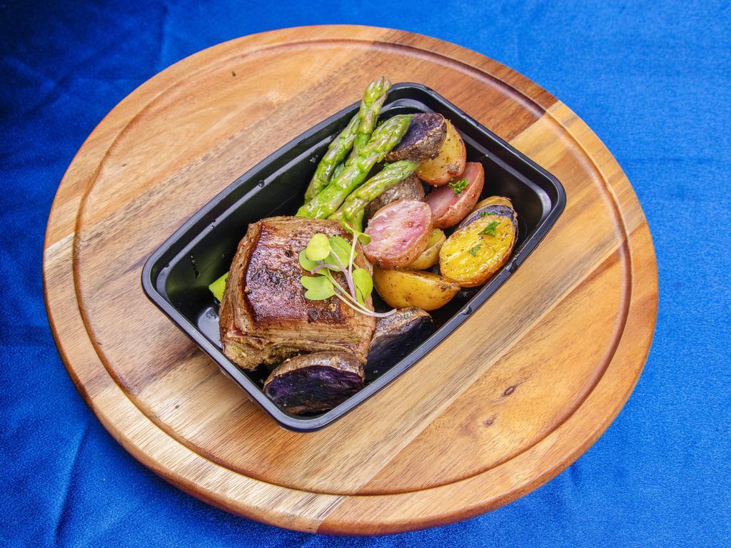 Garlic and Black Peppercorn Crusted Steak · Served with rosemary roasted potatoes and lemon and garlic asparagus.