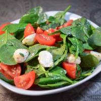 Spinach Salad · Fresh baby spinach, sun-dried tomatoes, mushrooms, croutons and feta cheese. 