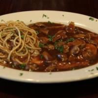 Chicken Marsala · Chicken breast in a brown gravy with mushrooms. Served with bread, salad and choice of spagh...