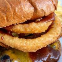 Western Burger · 1/3 LB Angus beef, cheddar cheese, two strips of bacon, two crispy onion rings, tangy BBQ sa...
