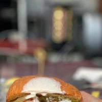 Fried Chicken Sandwich · Southern fried chicken on a brioche bun, topped with mayo and a dill pickle, served with fri...