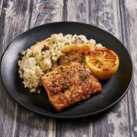 Pacific Coast Salmon  · Perfectly pan seared salmon served on our fabulous mushroom risotto and veggies.  Gluten free.
